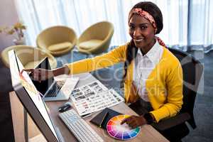 Business woman pointing at her screen