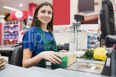 Portrait of woman cashier smiling