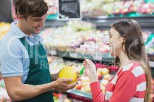 Shop assistant giving advises to a customer