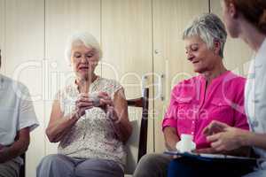 Seniors talking with nurse about medication