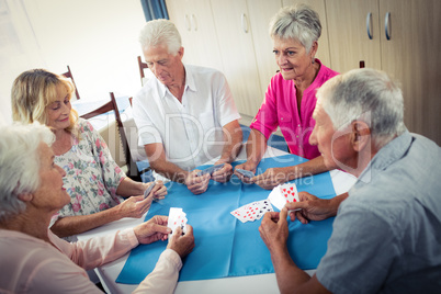 Group of seniors playing cards