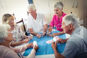 Group of seniors playing cards