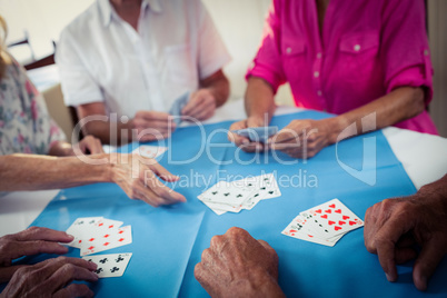 Group of seniors playing cards