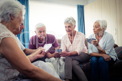 Group of seniors playing cards Group of seniors playing cards