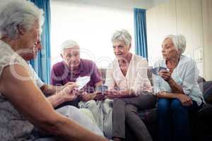 Group of seniors playing cards