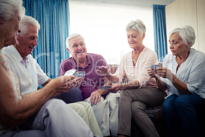 Group of seniors playing cards Group of seniors playing cards