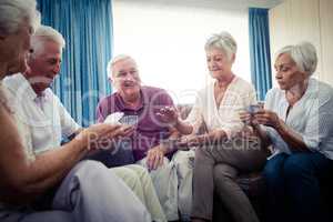 Group of seniors playing cards