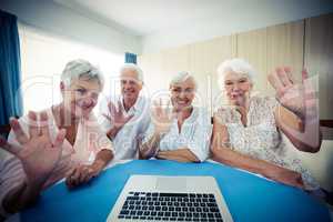 Group of seniors using a computer, view from webcam