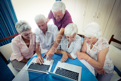 Group of seniors using a computer