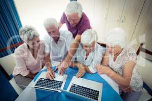 Group of seniors using a computer