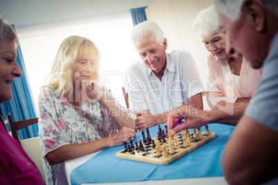 Group of seniors playing chess