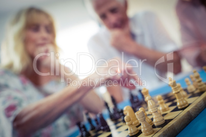 Group of seniors playing chess