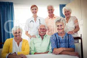 Portrait of a group of pensioners with nurse