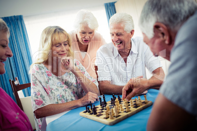 Group of seniors playing chess