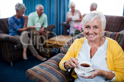 Portrait of a senior woman drinking a coffee