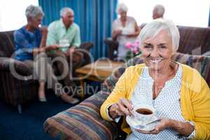 Portrait of a senior woman drinking a coffee