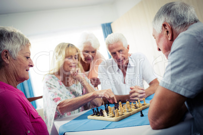 Group of seniors playing chess