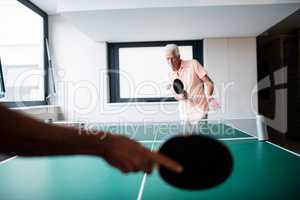 Senior playing ping pong