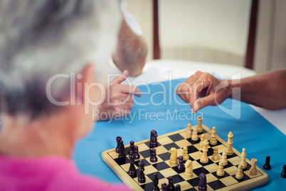 Group of seniors playing chess