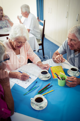 Group of seniors drawing and interacting