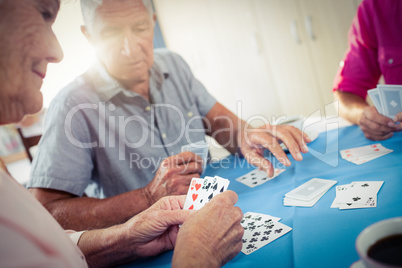 Group of seniors playing cards