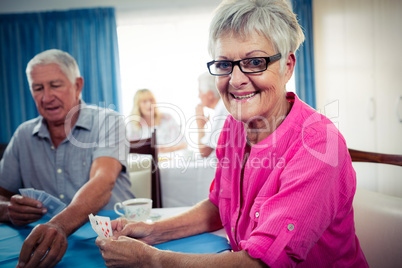 Group of seniors playing cards