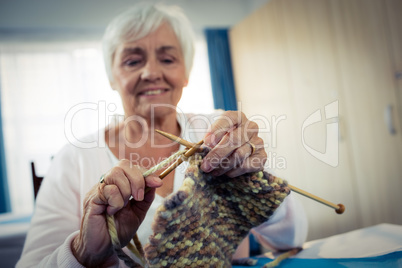 Senior woman sewing