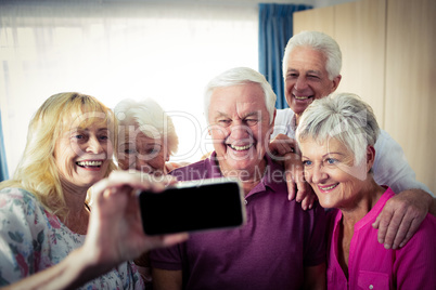 Group of seniors doing a selfie with a smartphone