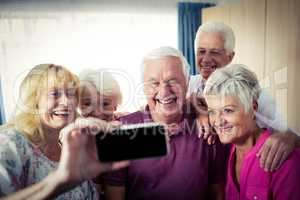 Group of seniors doing a selfie with a smartphone