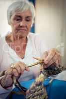Senior woman sewing
