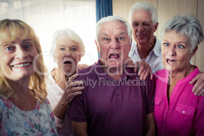 Portrait of seniors doing funny faces