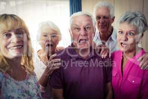 Portrait of seniors doing funny faces