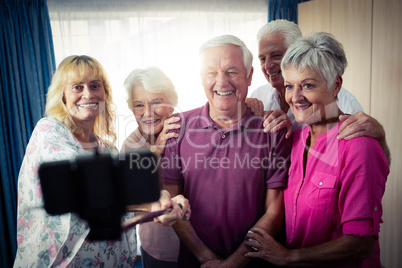 Group of seniors doing a selfie with a smartphone