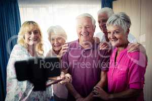 Group of seniors doing a selfie with a smartphone