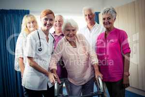 Portrait of a group of pensioners with nurse