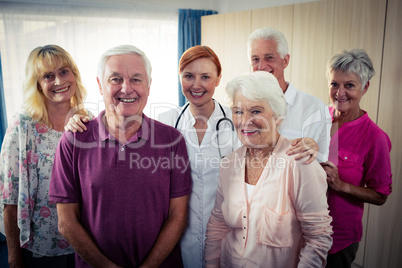 Portrait of a group of pensioners with nurse