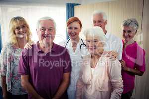 Portrait of a group of pensioners with nurse