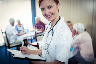 Portrait of a nurse with clipboard