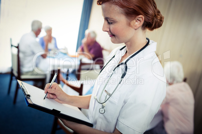 Portrait of a nurse with clipboard