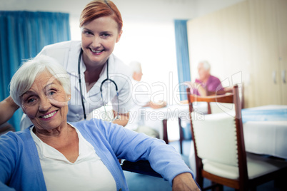 Portrait of nurse with a senior woman