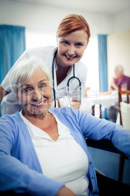 Portrait of nurse with a senior woman