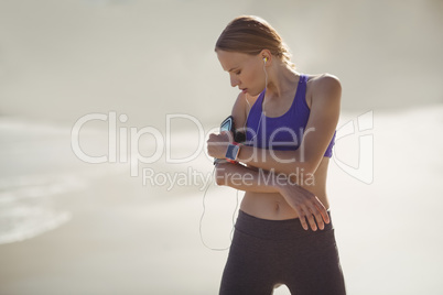 Woman listening music on mobile phone