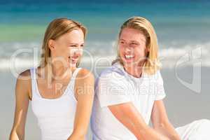 Couple sitting on beach