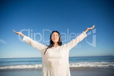 Woman standing with arms outstretched