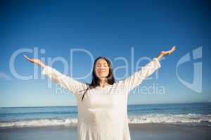 Woman standing with arms outstretched