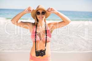 Attractive woman in bikini posing on beach