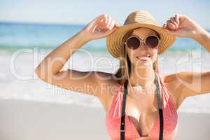 Attractive woman in bikini posing on beach