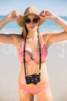 Attractive woman in bikini posing on beach