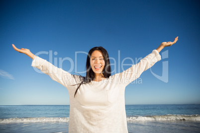 Woman standing with arms outstretched