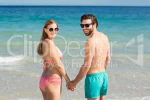 Couple standing on beach